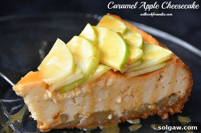 A close-up of a single slice of caramel apple cheesecake, perfectly cut and ready to be enjoyed, showcasing the layers of crust, filling, and apple topping.