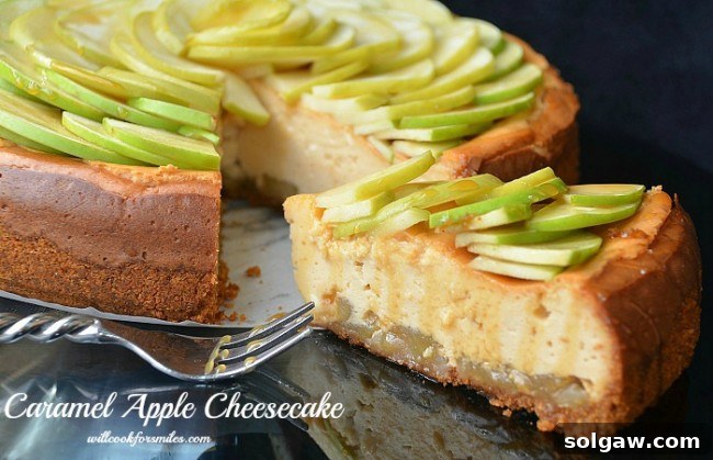 A beautifully presented caramel apple cheesecake on a table, with a slice gently pulled away and a fork resting beside it, inviting you to take a bite.