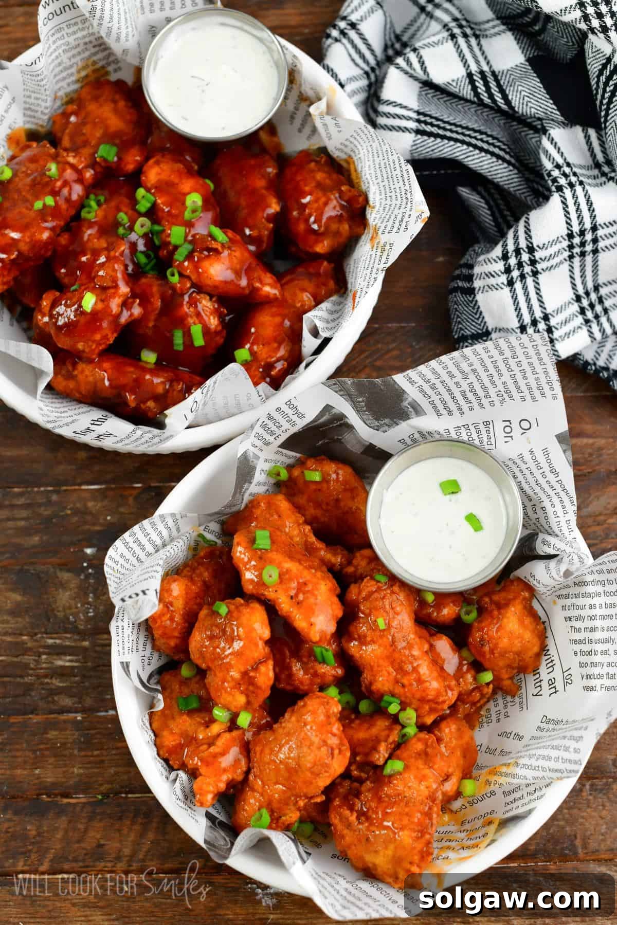 Crispy Chicken Bites 7 two bowls of boneless wings one with buffalo wing sauce and one with bbq.