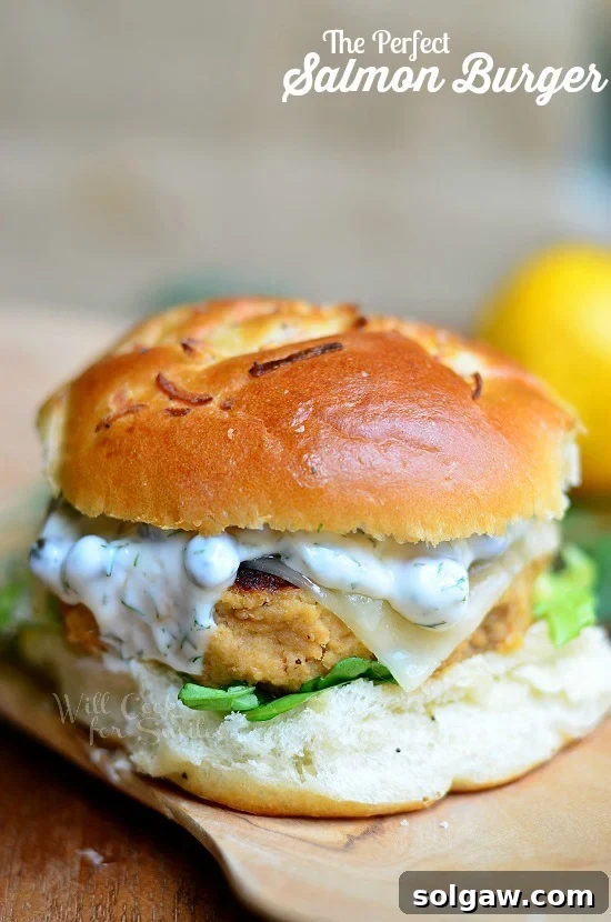 The Perfect Salmon Burger with a bun, beautifully plated.