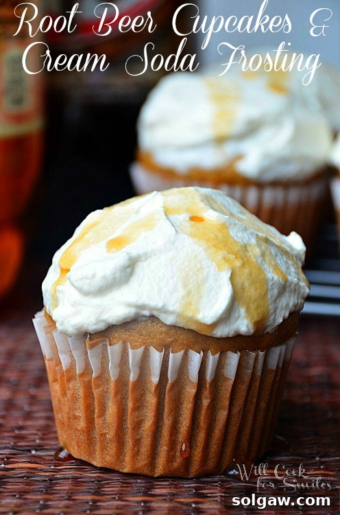 Velvety Marble Cupcakes with Swirled Cream Cheese Frosting 11 Nostalgic Root Beer Cupcakes topped with a light and airy cream soda frosting, arranged on a rustic wood table.