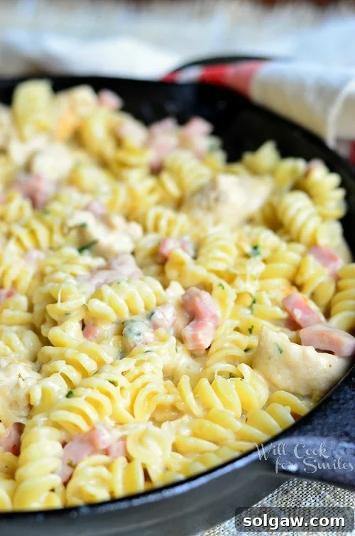 Chicken Cordon Bleu Pasta Dish in a cast iron skillet
