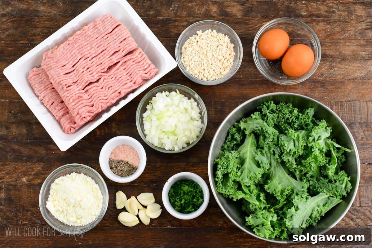 Ingredients for Kale and Feta Turkey Burgers arranged neatly on a rustic wooden board, including ground turkey, fresh kale, feta cheese, eggs, and seasonings.