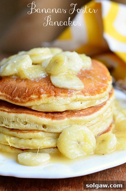 Spiced Apple Pie French Toast 16 Bananas Foster Pancakes on a plate with caramelized bananas, sitting on a table