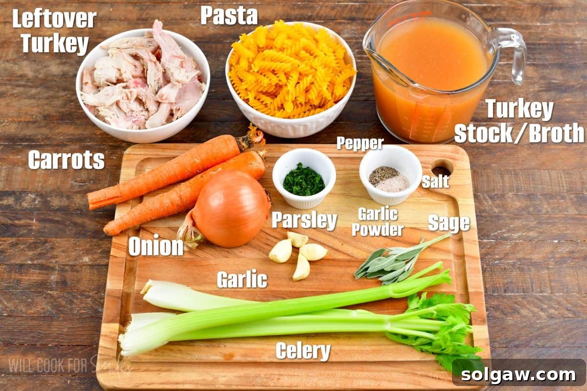 labeled ingredients to make leftover turkey noodle soup on and next to a cutting board.