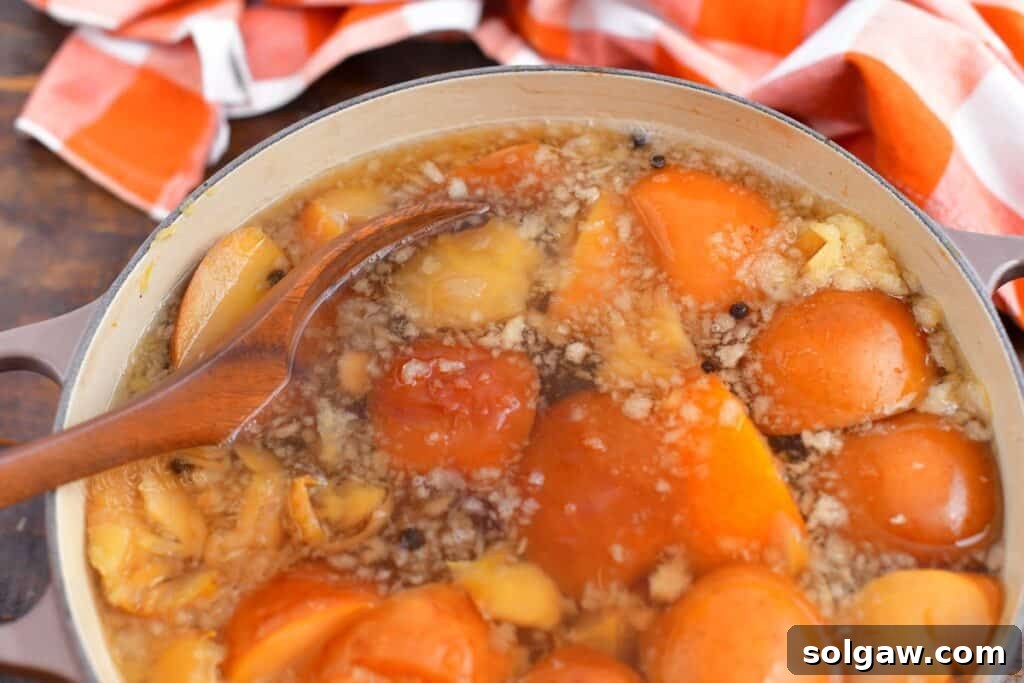 Wholesome Homemade Apple Cider 5 making homemade apple cider in pot on stove top