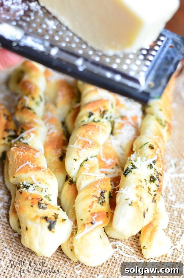 Close-up of Homemade Parmesan Garlic & Herb Breadsticks with rich Italian flavors.