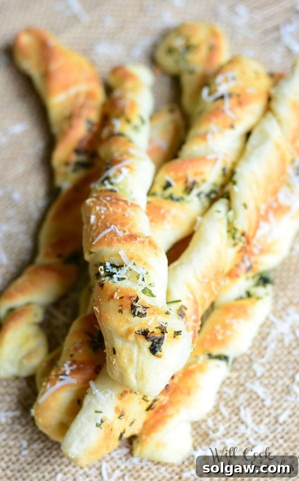 Delicious Homemade Parmesan Garlic & Herb Breadsticks, perfect for sharing.