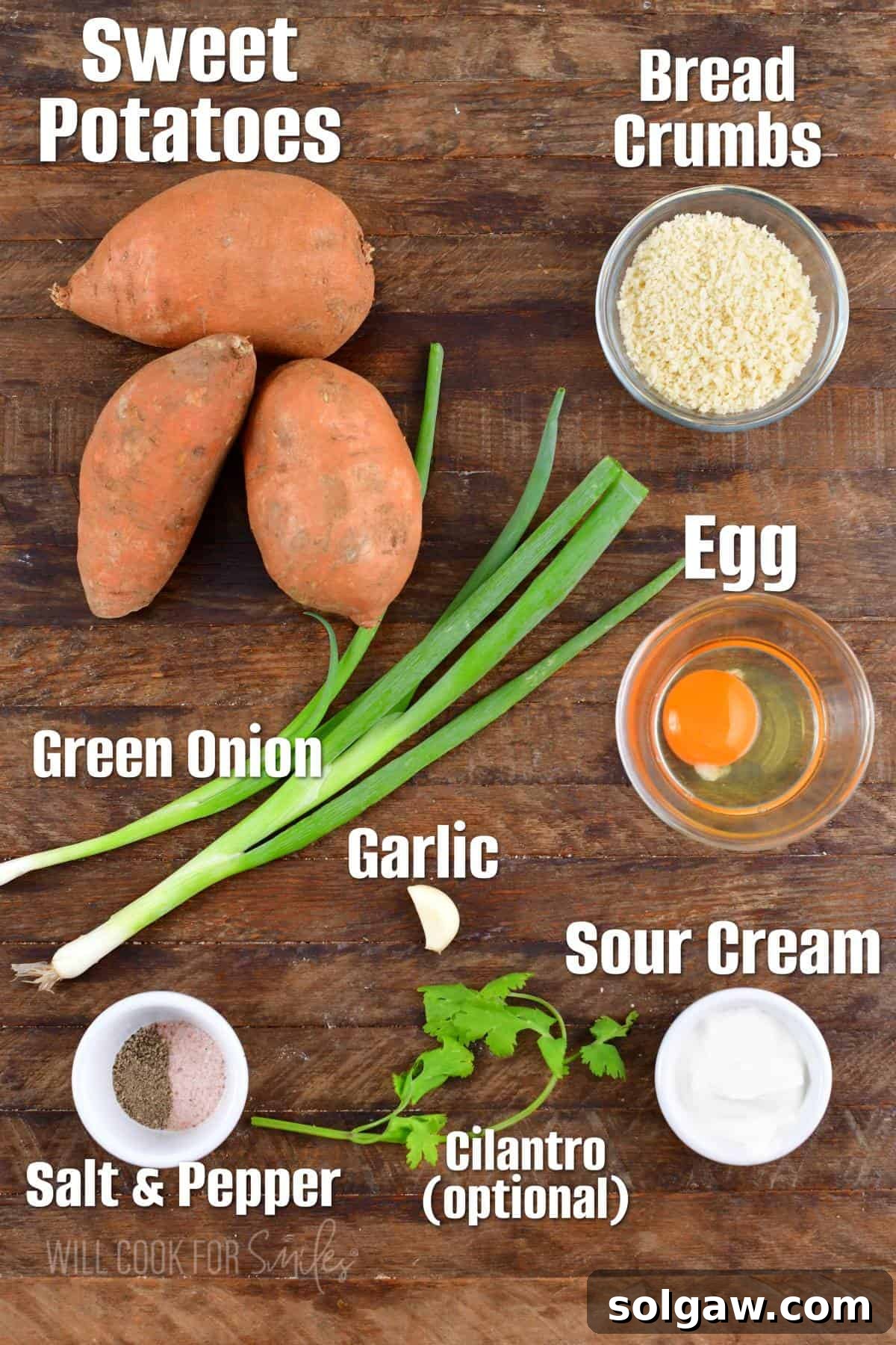 The ingredients for sweet potato cakes are placed on a wooden surface. 