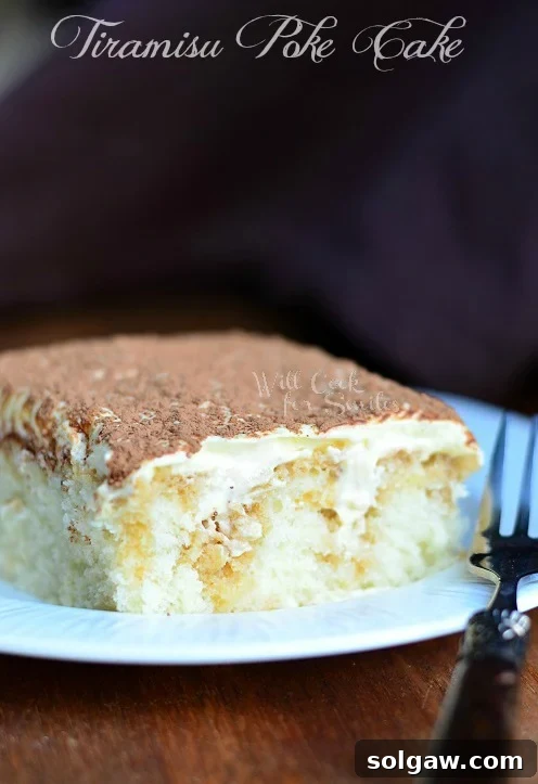 Tiramisu Poke Cake - a luscious white cake infused with coffee and mascarpone cream, topped with cocoa.