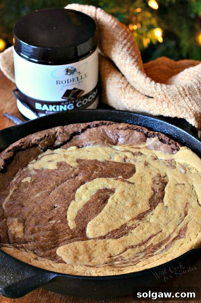 Dreamy Vanilla Bean Swirl Skillet 3 A whole Vanilla Bean Marble Skillet Cookie baked to golden perfection in a cast iron pan, ready to be served.