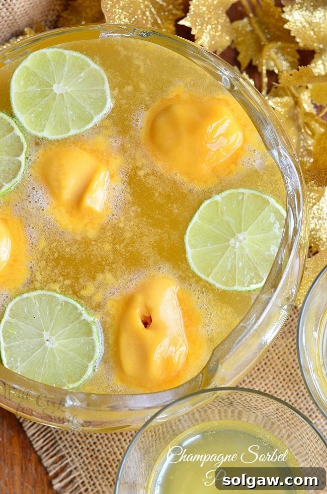Vibrant Champagne Sorbet Punch served in an elegant glass with a festive background, perfect for New Year's Eve or any special occasion.