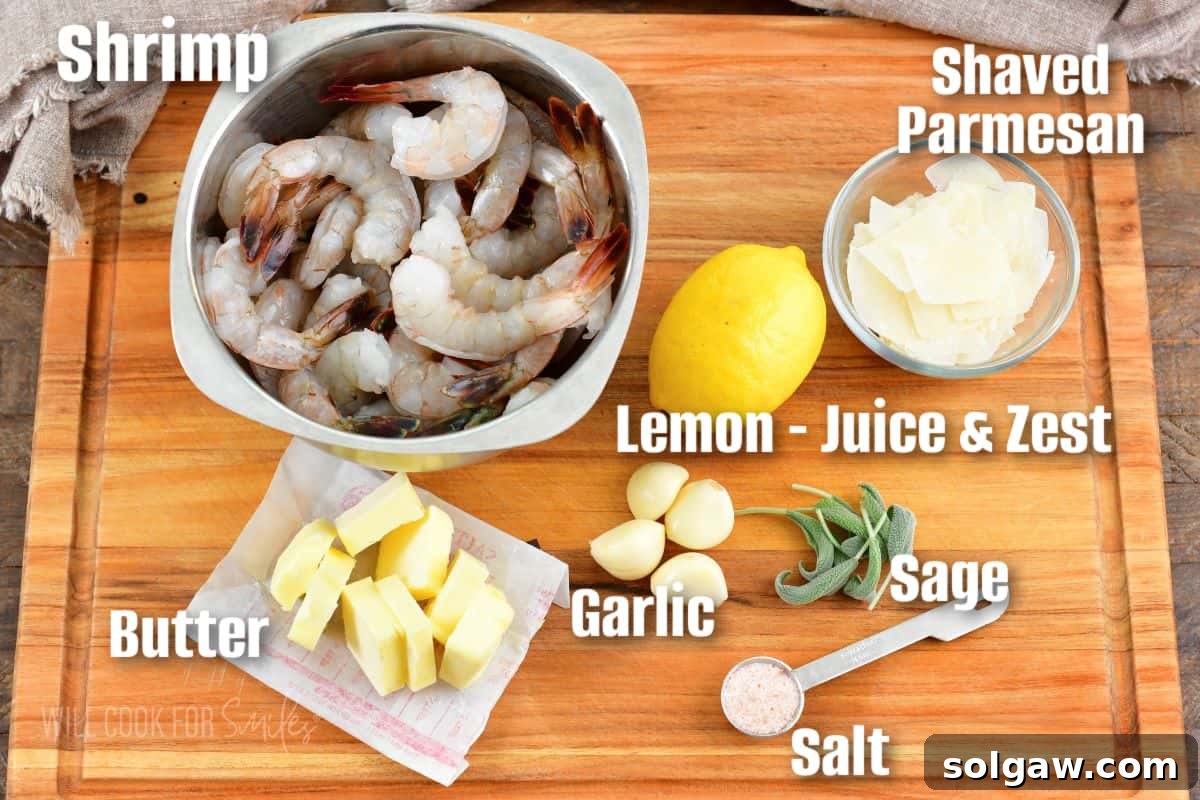 Labeled ingredients to make garlic butter shrimp on cutting board.
