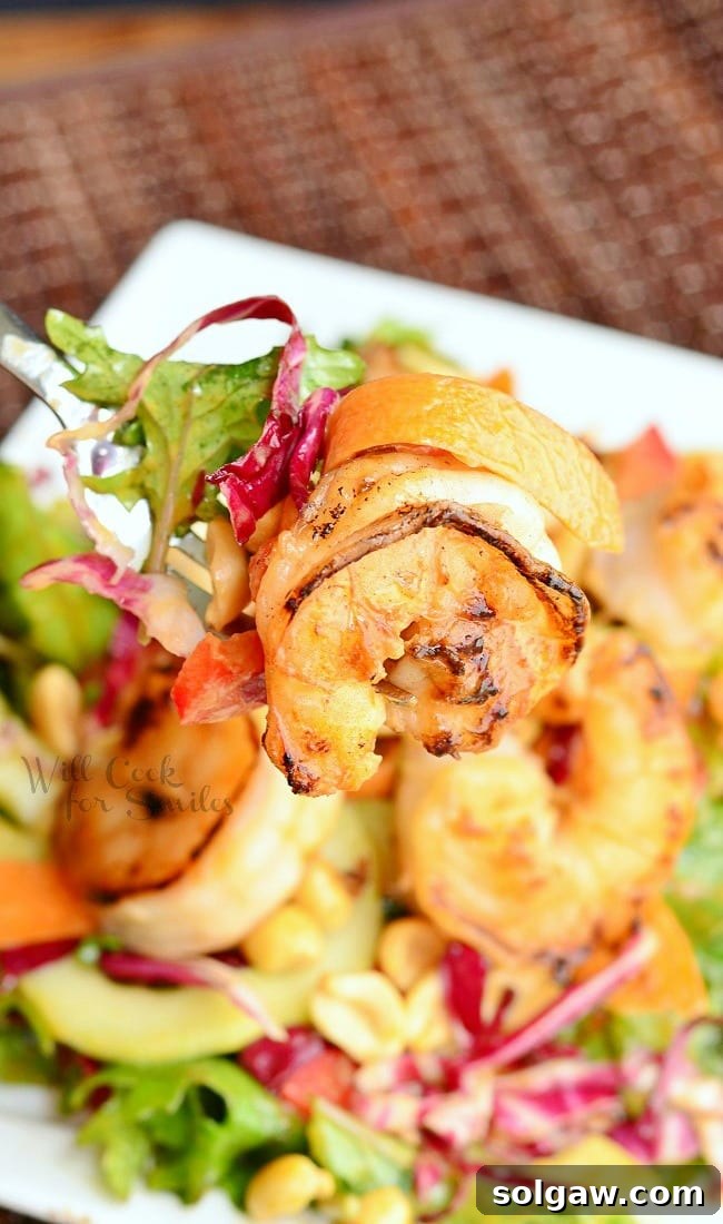 Zesty Thai Shrimp Salad with Creamy Peanut Dressing 6 Close-up of a serving of Thai Shrimp Salad, showing the succulent shrimp, finely shredded vegetables, and generous peanut dressing