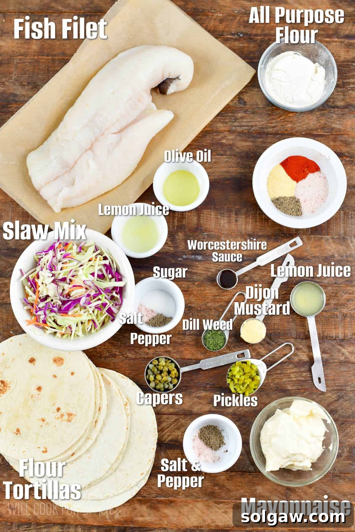 Labeled ingredients for Fried fish tacos on a wood surface.