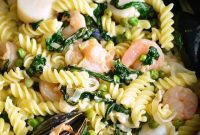 Creamy Seafood Pasta with Garden Spinach and Sweet Peas
