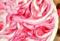 Decadent White Chocolate Raspberry Swirl Cheesecake