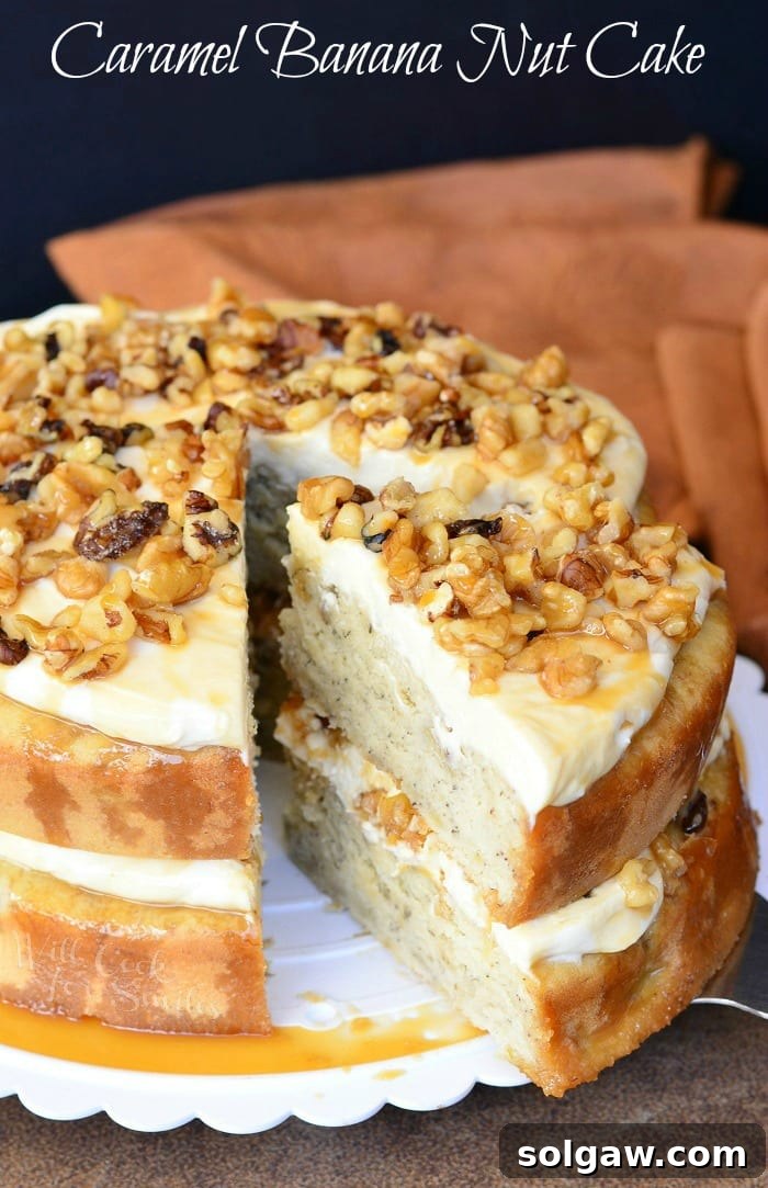 A beautiful slice of Caramel Banana Nut Cake on a white cake stand, showcasing its moist layers and generous frosting