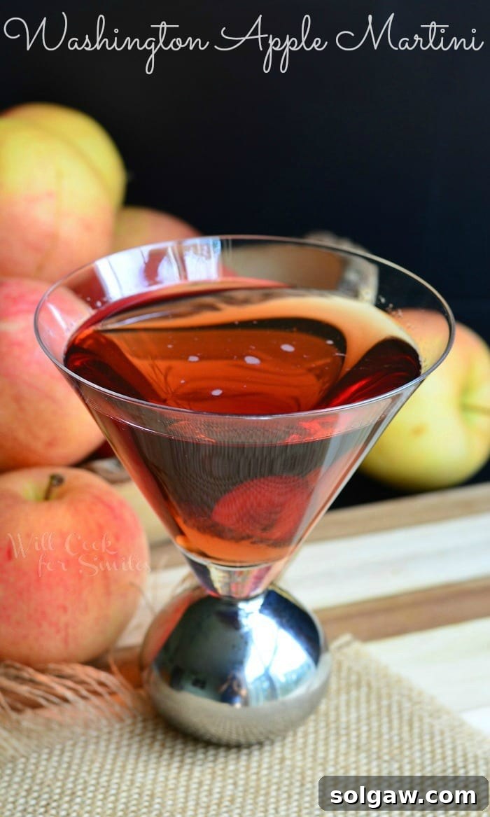 Washington Apple Martini served in a stylish glass, garnished with an apple slice, from willcookforsmiles.com