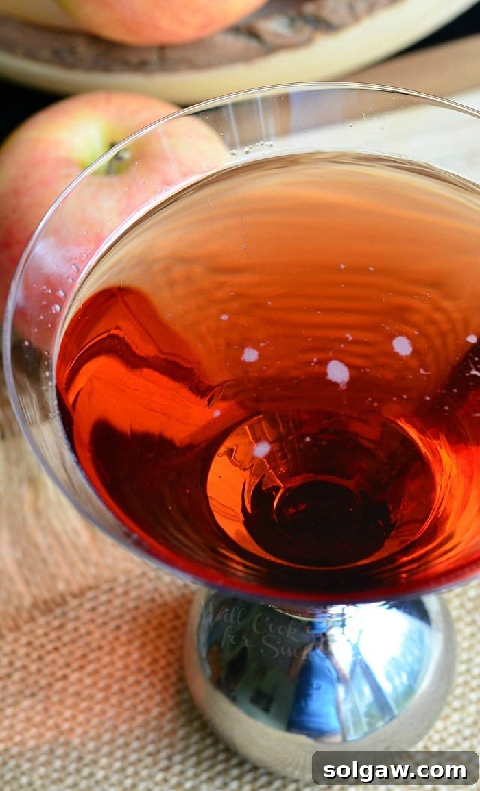 Washington Apple Martini in a coupe glass with apple slices, from willcookforsmiles.com