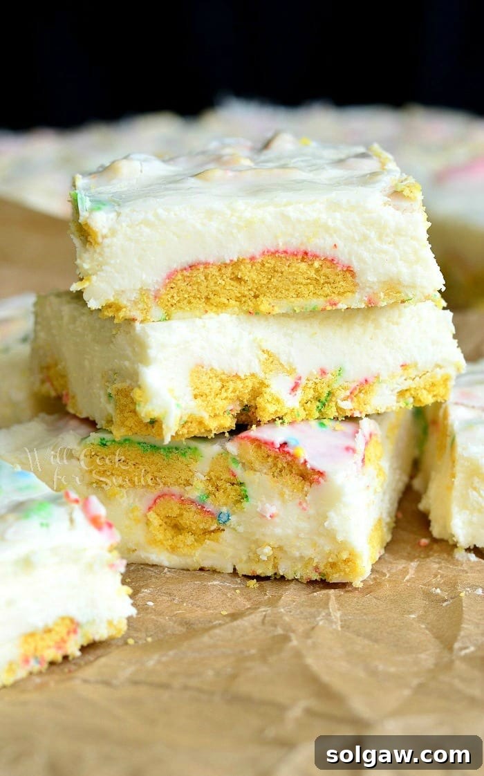Sugar Cookie Fudge stacked up on parchment paper