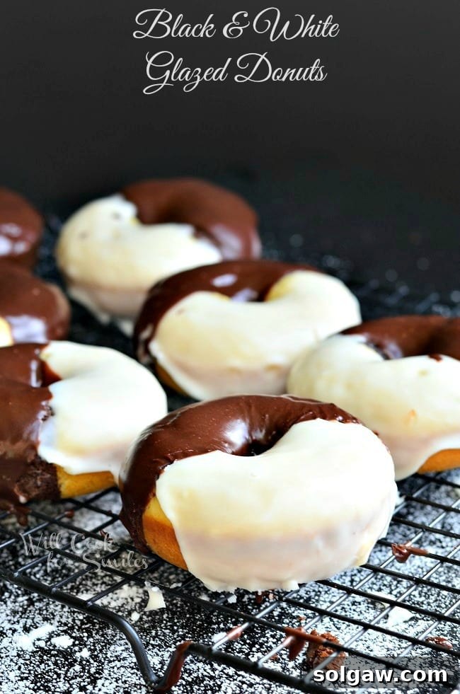 Black & White Glazed Donuts on a cooling rack, showcasing contrasting white and chocolate glazes, ready to be enjoyed.