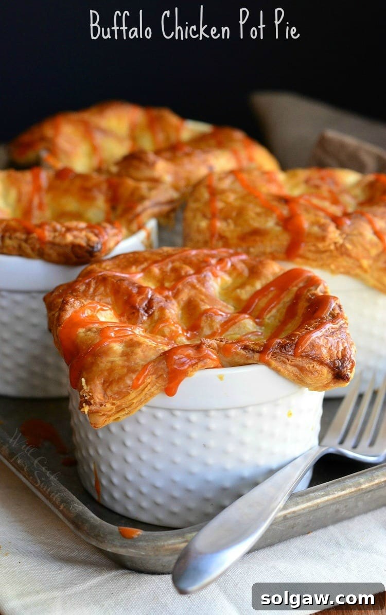 Individual Buffalo Chicken Pot Pies nestled in ramekins, ready to be served or enjoyed
