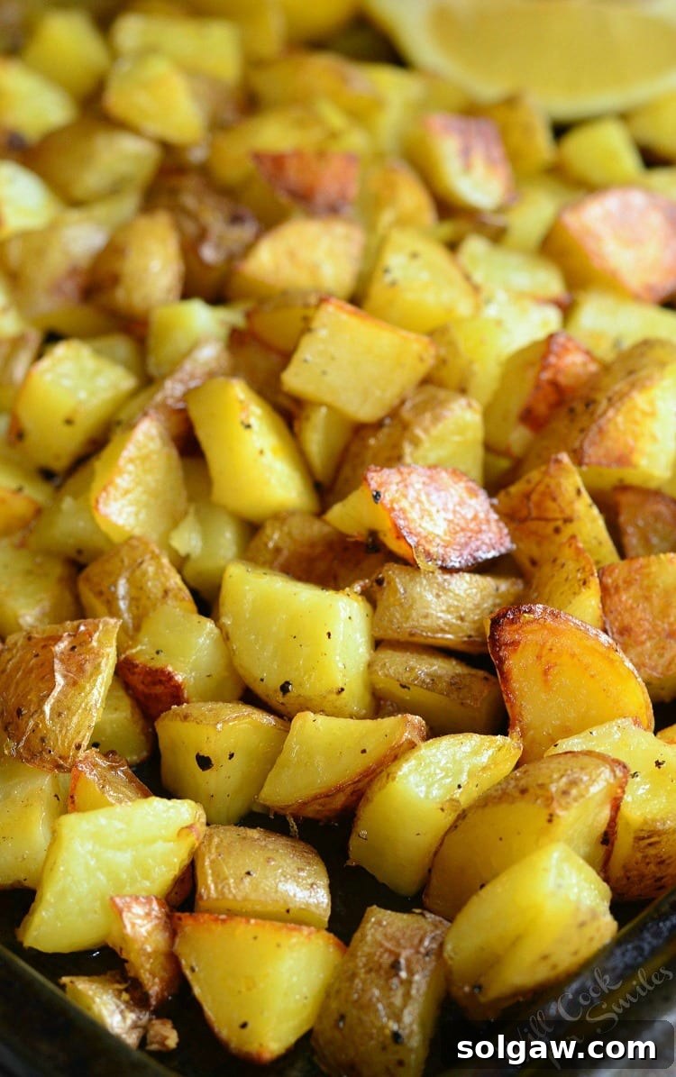 A dish of freshly roasted Truffle Lemon Pepper Roasted Potatoes, ready to be served.