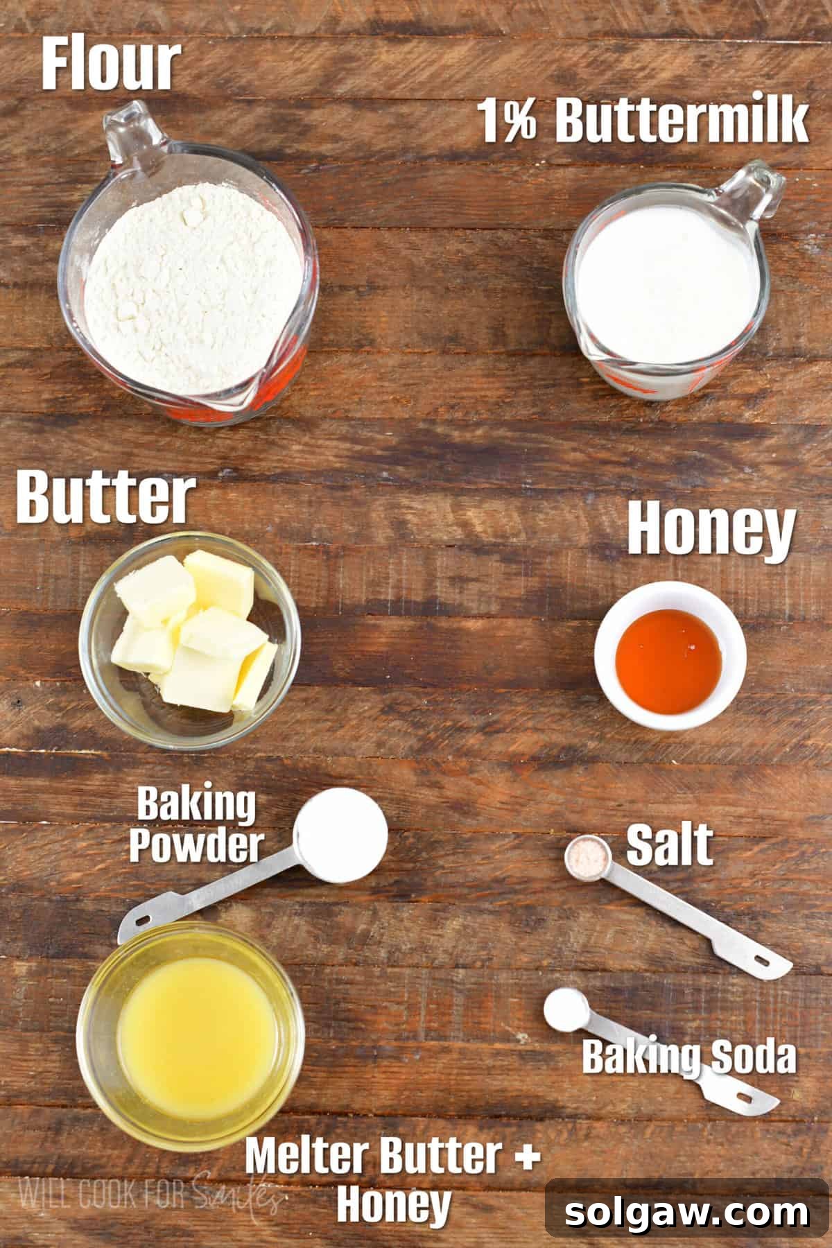 labeled ingredients for honey butter biscuits on a wood surface.
