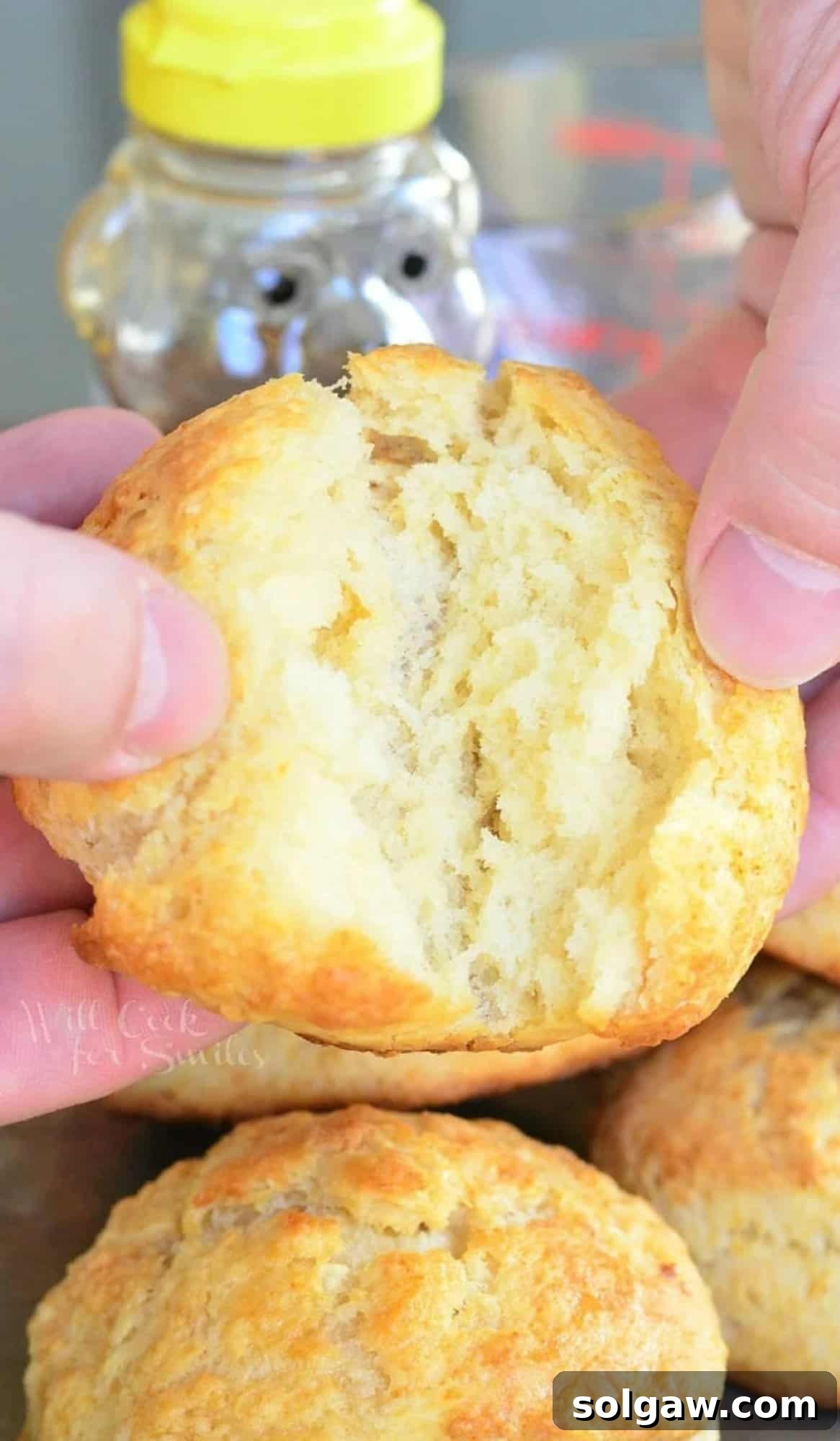 honey butter biscuits being broke in half.