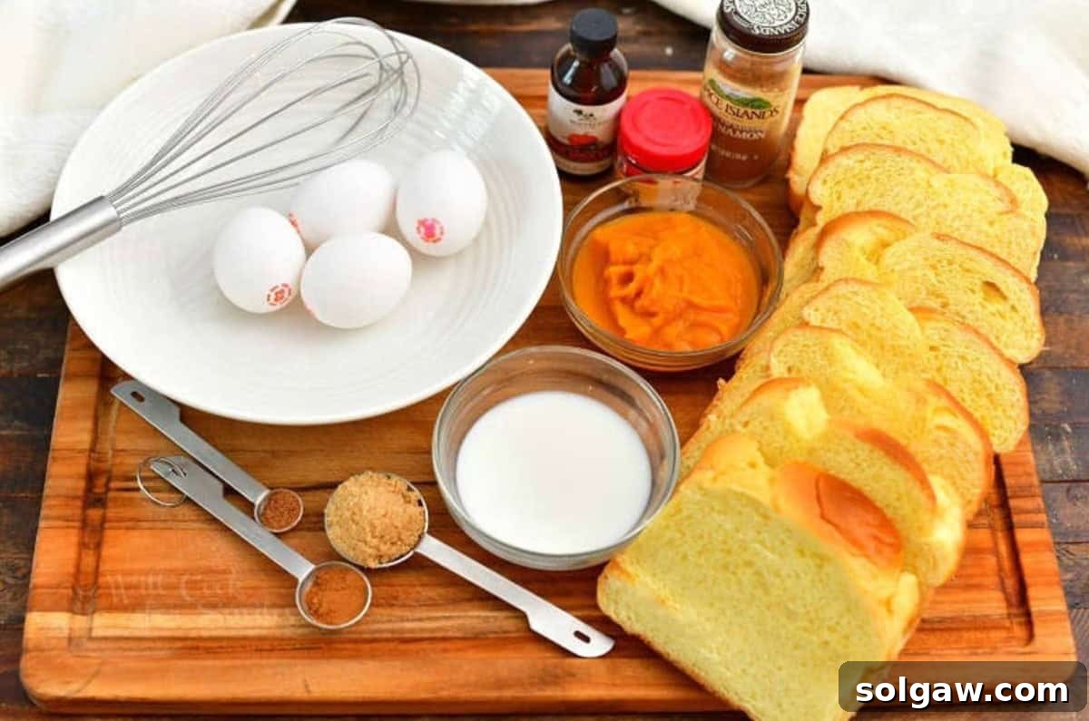 Spiced Pumpkin French Toast 3 ingredients to make pumpkin French toast on a wooden cutting board.