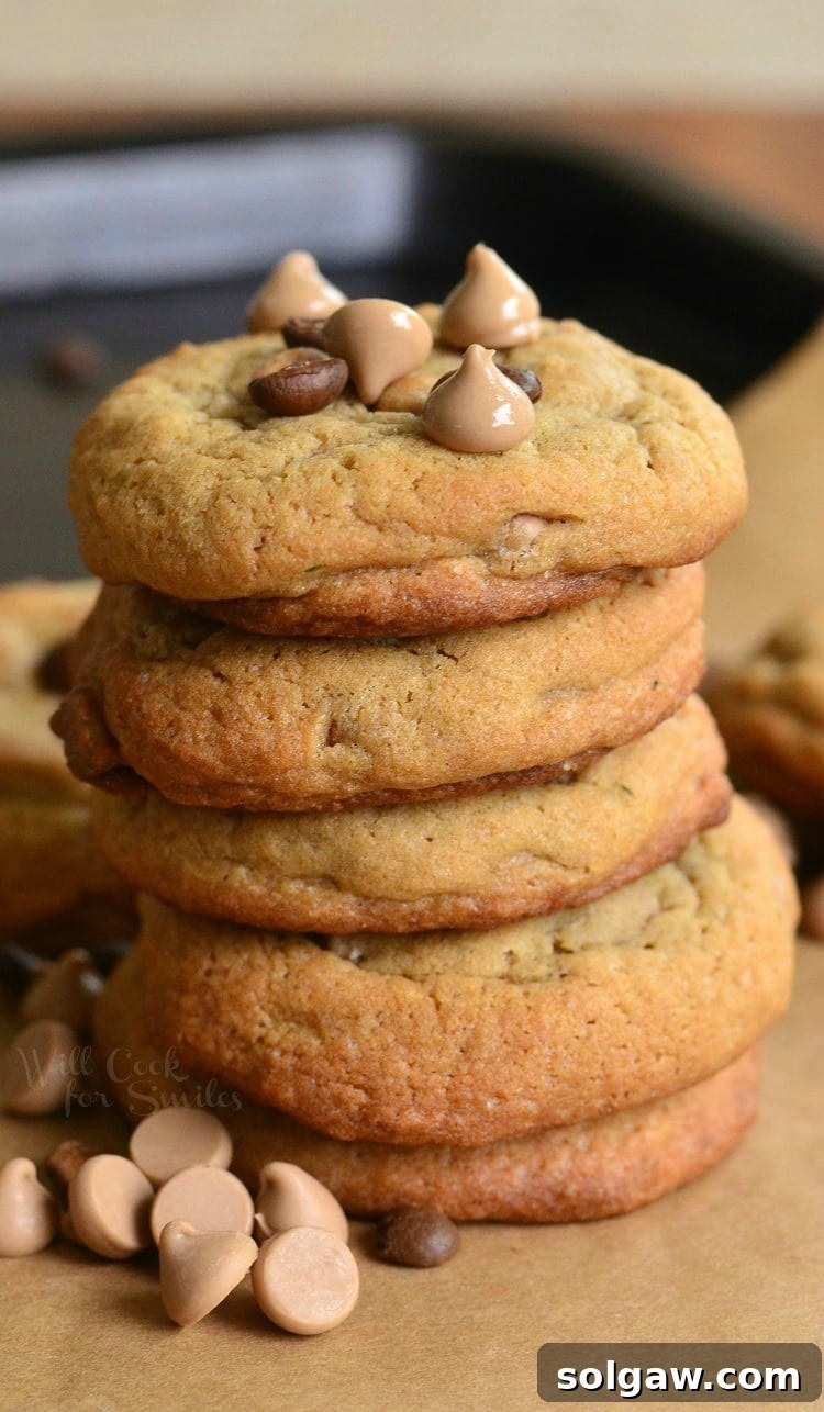 Cappuccino Cookies stacked up with chocolate chips and cappuccino chips around it and ontop