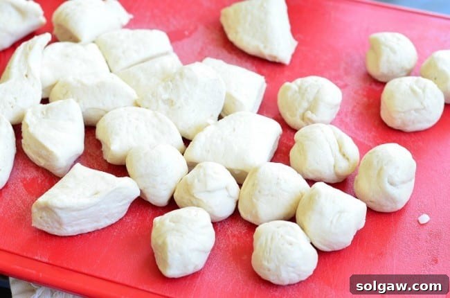 Biscuits cut into quarters and rolled into small balls