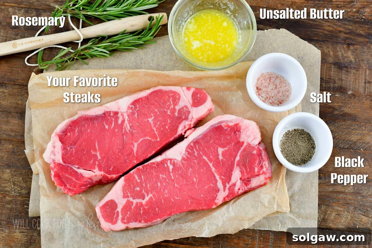 The Art of Grilling Perfect Steaks 3 Ingredients for grilling steak, including a seasoned steak, fresh rosemary, and butter on a wooden board.