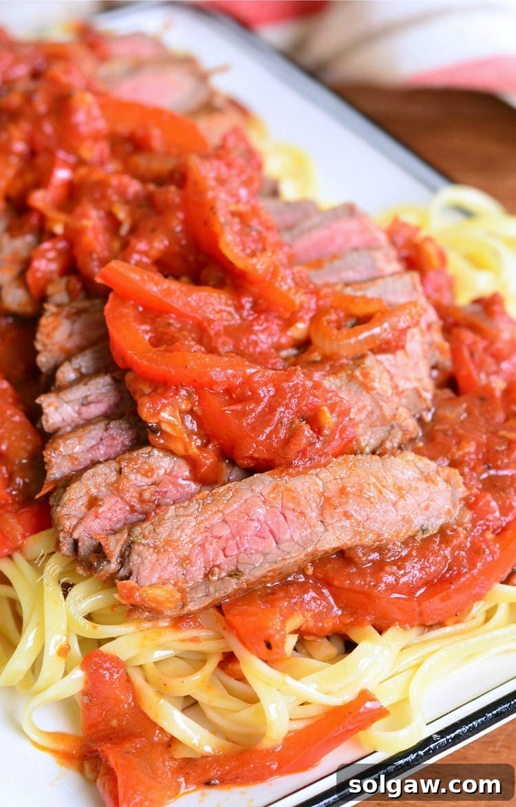 Rustic Steak Pizzaiola Linguine 2 A beautifully presented plate of Steak Pizzaiola Linguine, showing seared sirloin steak, rich tomato sauce, and perfectly cooked pasta.