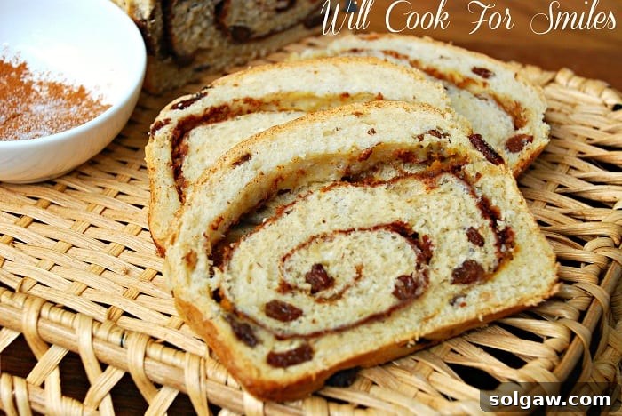 Two generous slices of Pumpkin Spice Swirl Bread served on a rustic wicker tray, alongside a bowl of ground cinnamon.