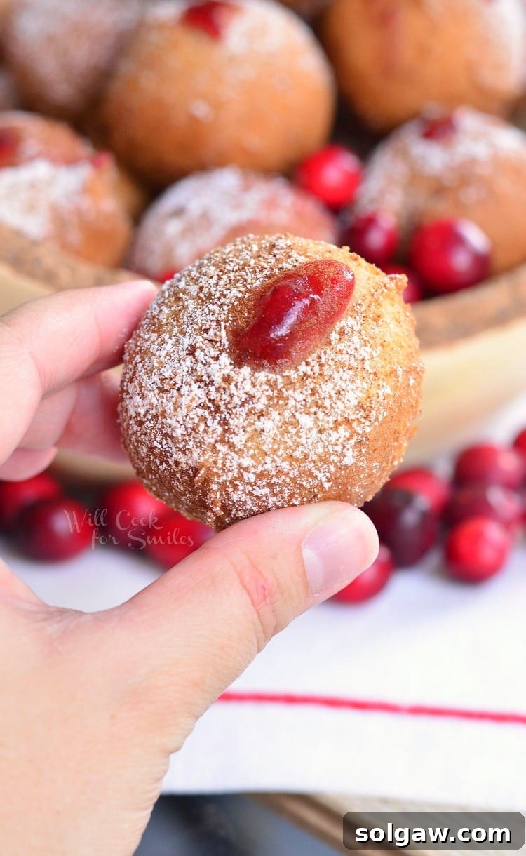 holding Cranberry Sauce Doughnut Hole