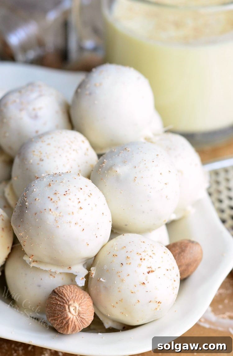 Eggnog Cookie Balls stacked in a white bowl