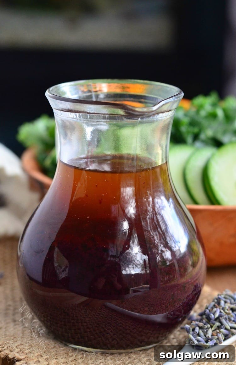Freshly prepared Blueberry Lavender Vinaigrette in an elegant glass jar.
