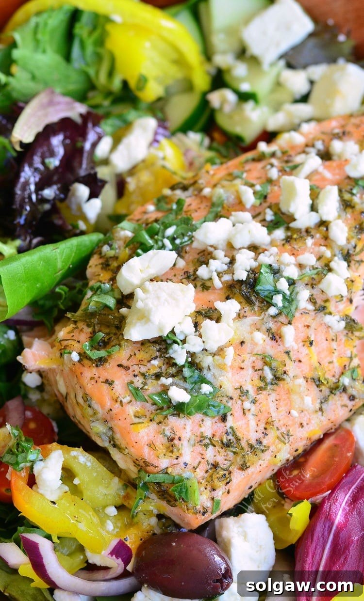 Delicious Greek Salmon Salad with feta cheese on top, served in a rustic bowl