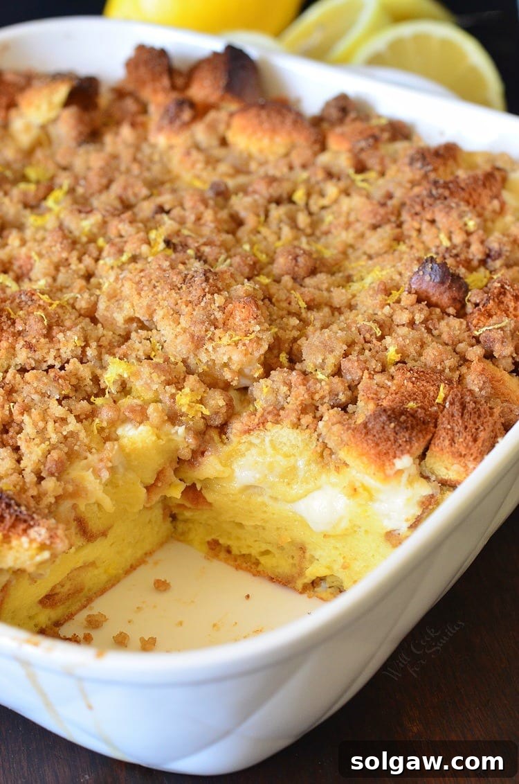 A baked French toast casserole dish with a single slice removed, ready to be enjoyed, highlighting its comforting and inviting nature.
