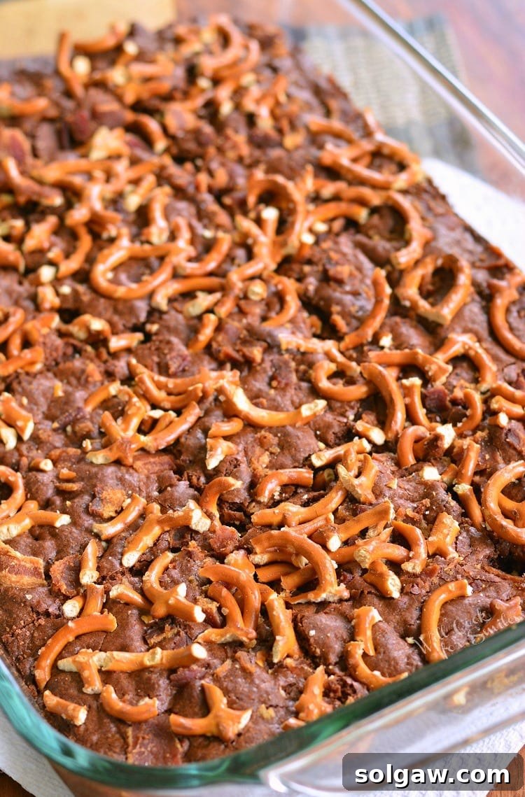 Pretzel Bacon Brownies cooling in a baking pan, ready to be cut and served