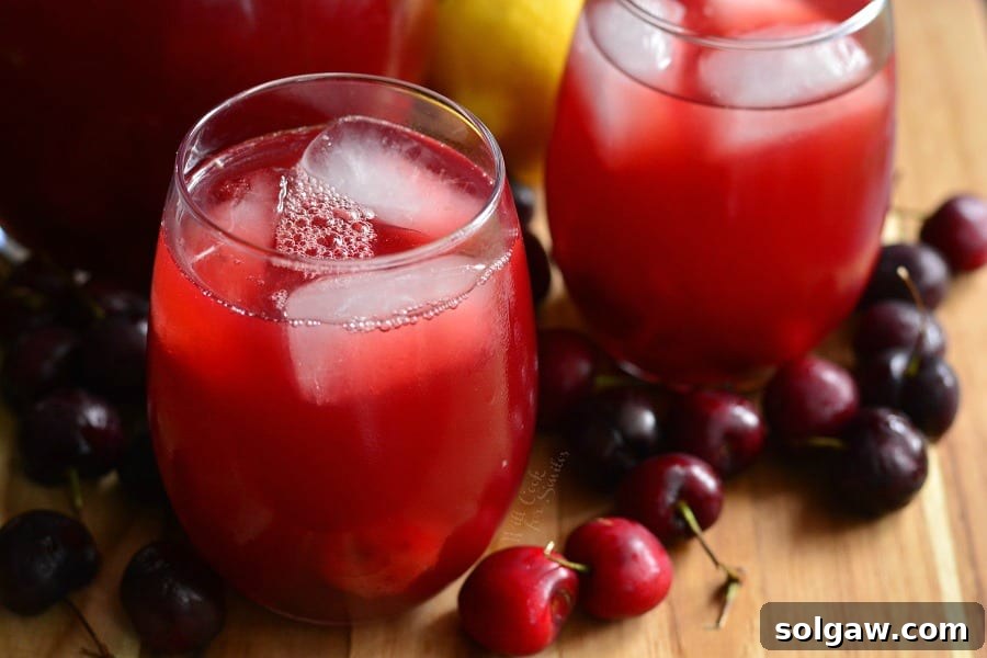 2 Stemless wine glass with Cherry Arnold Palmer on a cutting table with cherries around it