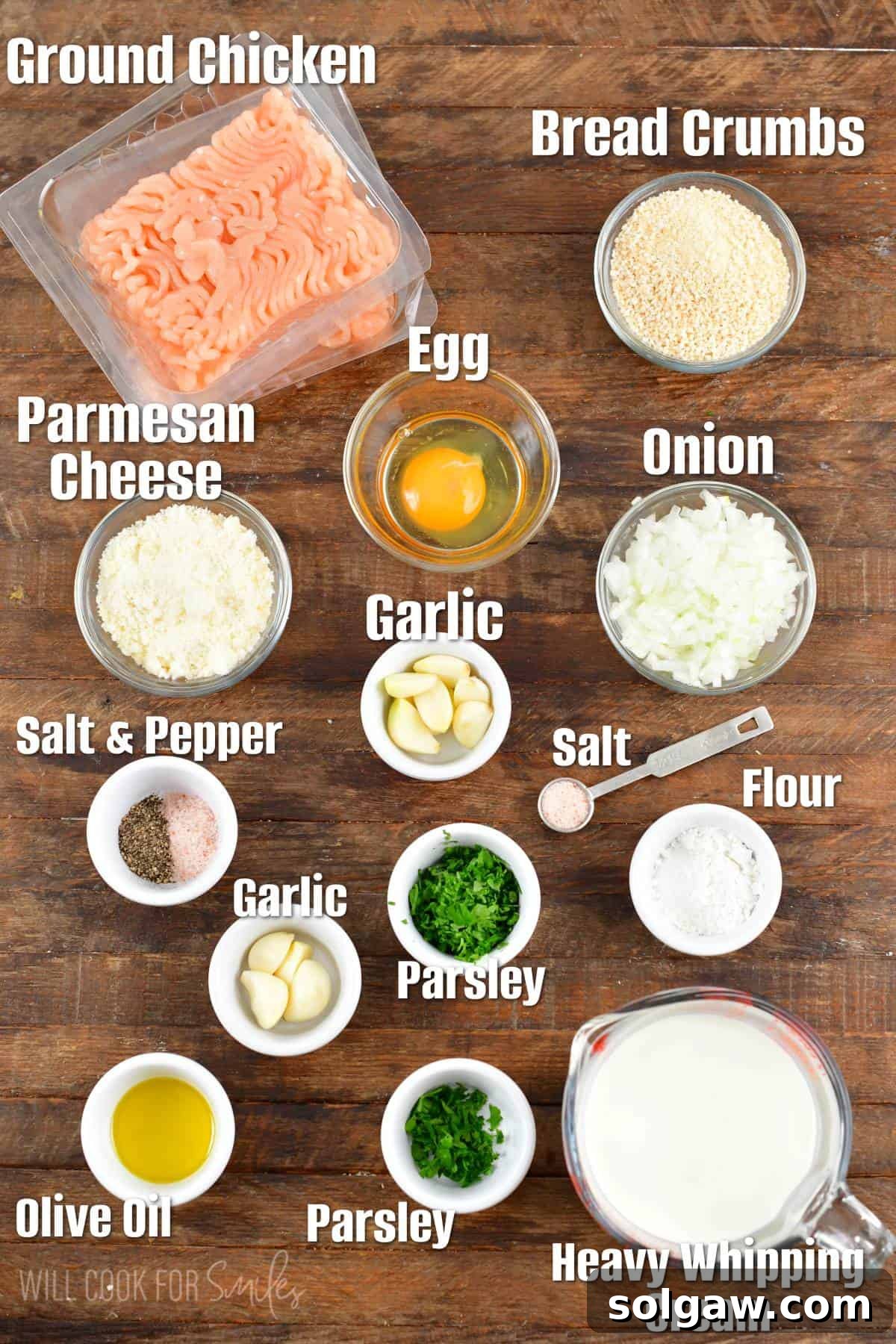 Parmesan Garlic Chicken Mini Loaves 3 The ingredients for chicken meatloaves are spread out on a wooden surface.