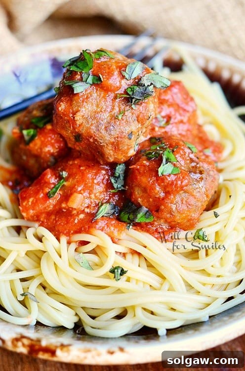 spaghetti and meatballs on a plate 