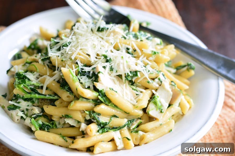 Garlic and Spinach Alfredo Chicken Pasta in a bowl