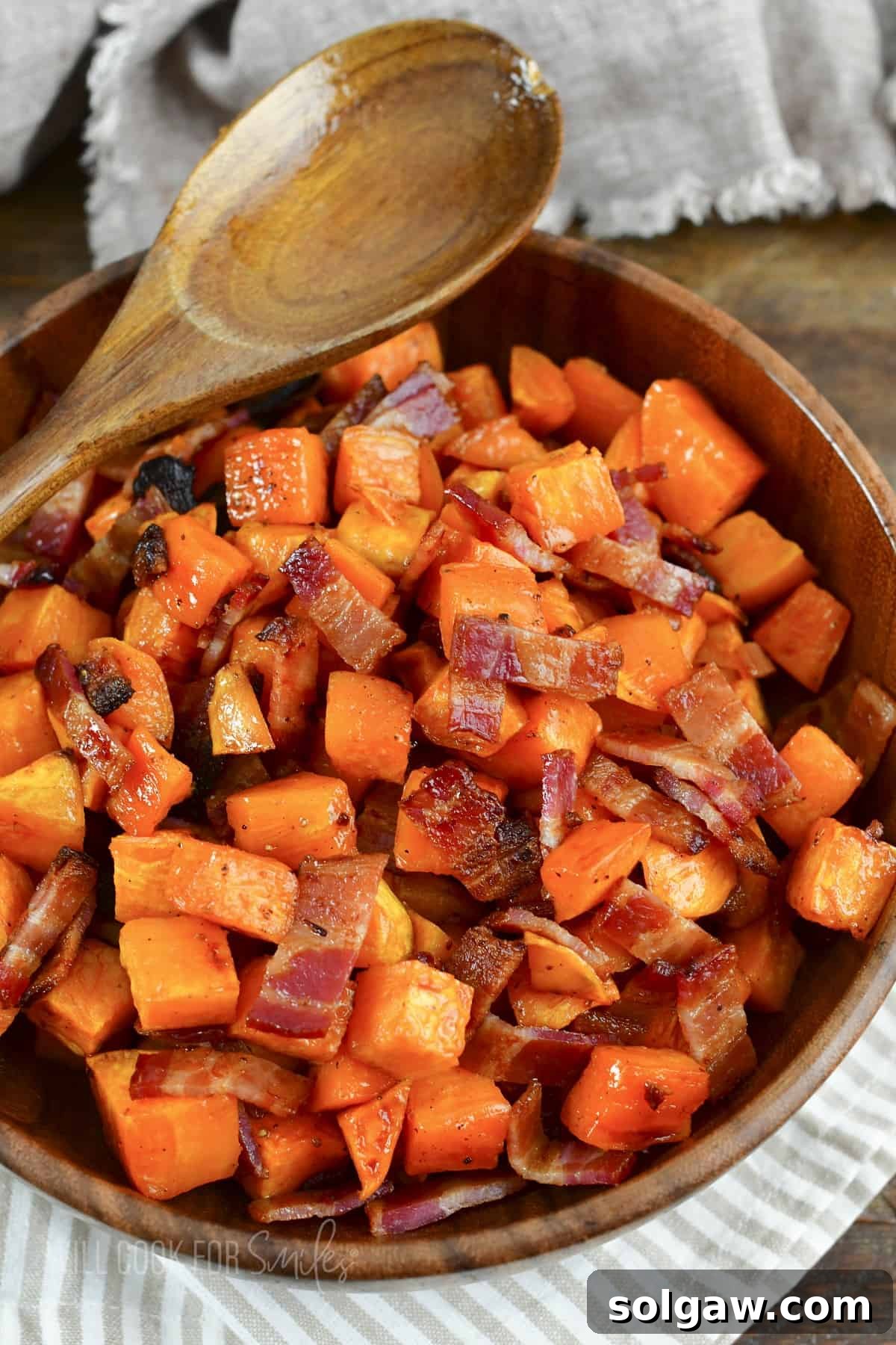 top view of the cubed sweet potatoes and bacon in a bowl.