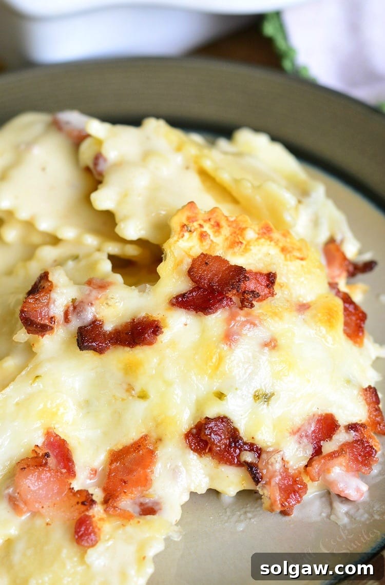 Golden-Baked Ravioli Mac with Crispy Bacon 8 Baked Ravioli Mac and Cheese with Bacon on a plate
