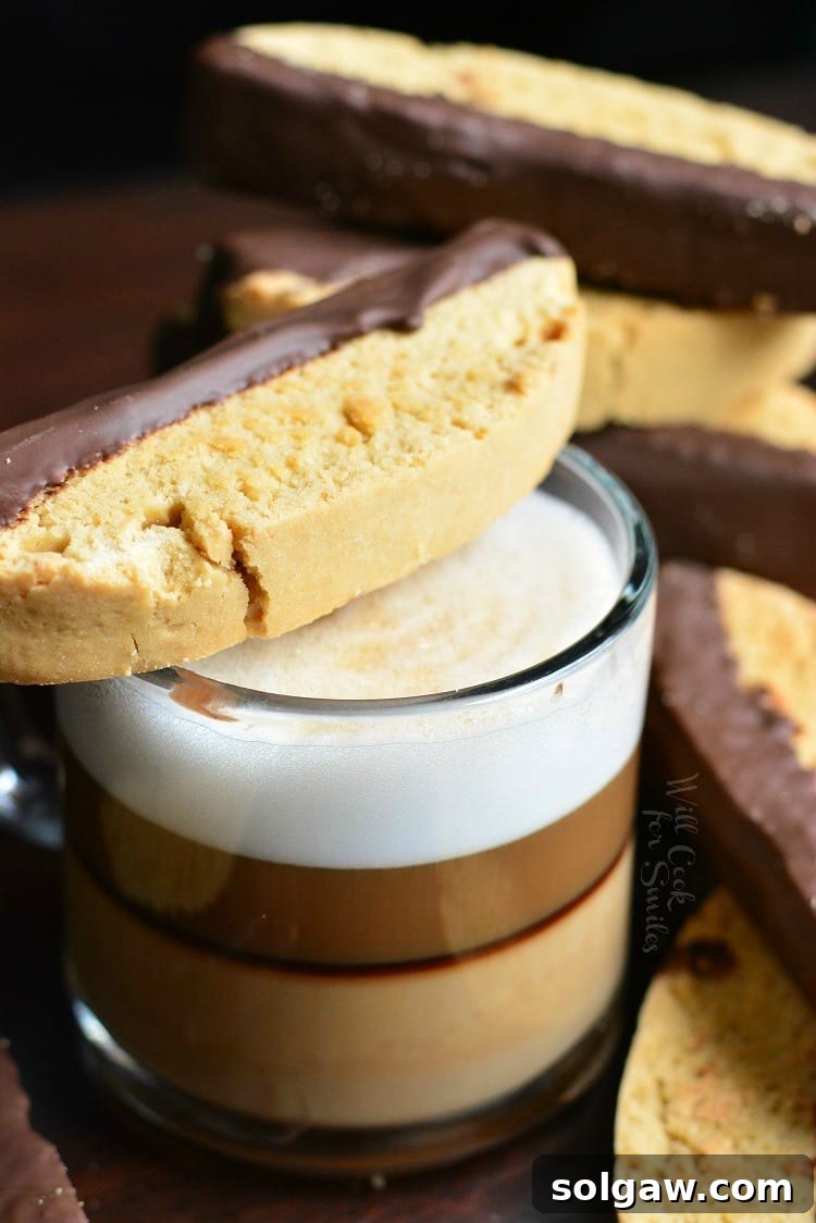 Dark Chocolate Cappuccino Biscotti across mug with espresso in it