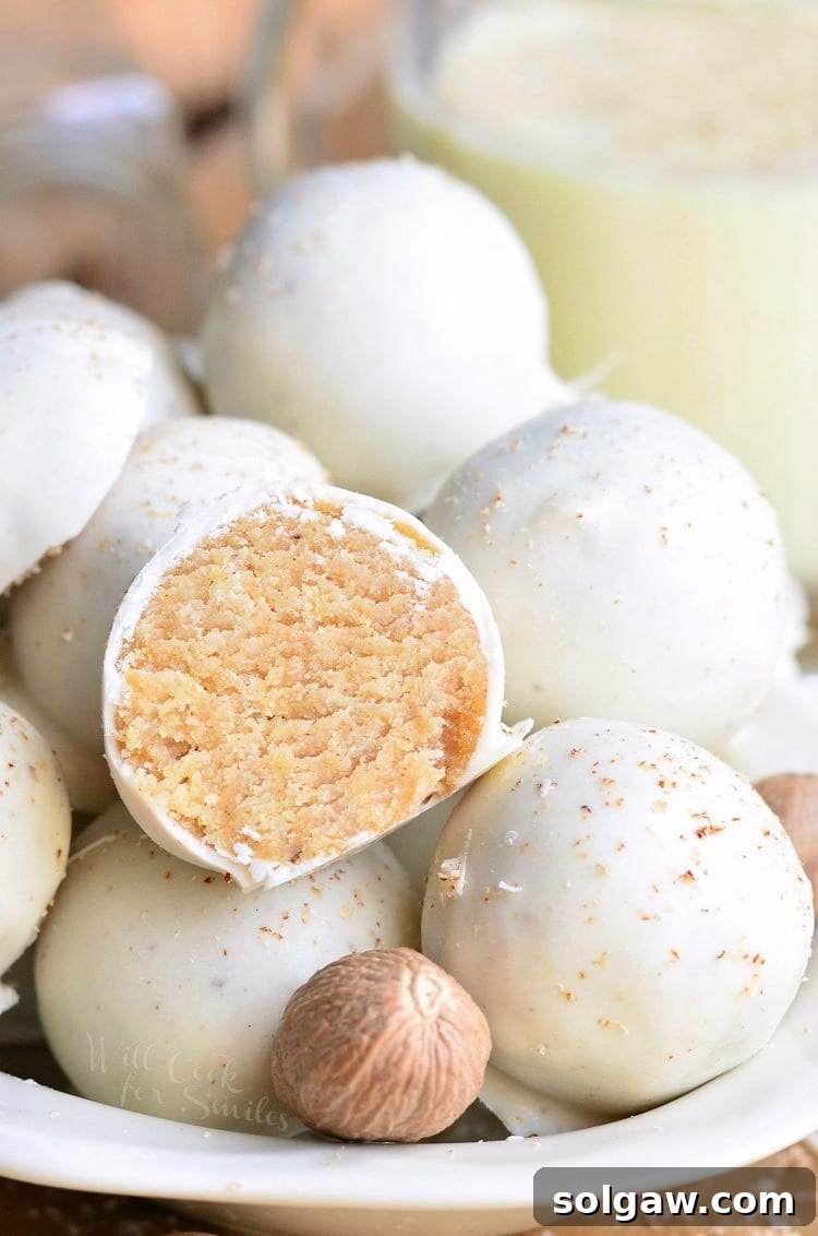 Stacked eggnog cookie balls, a festive and bite-sized dessert option.
